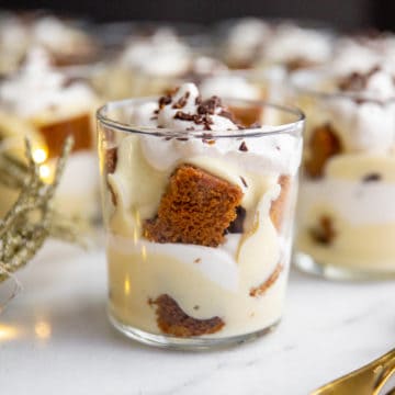 Close-up of gingerbread trifle in a serving glass.