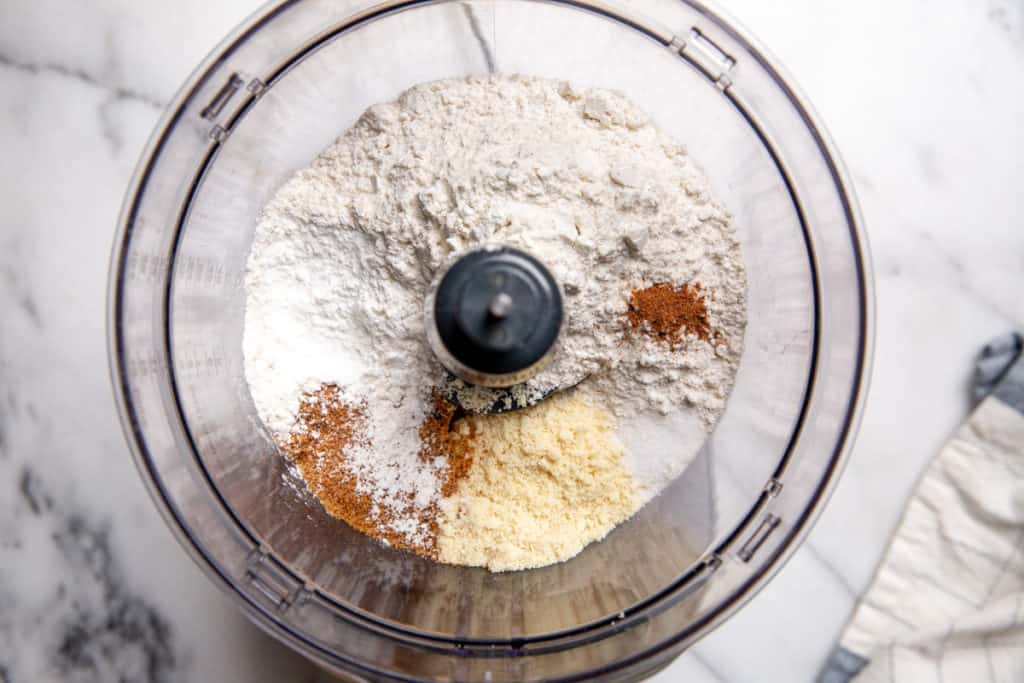 Process shot showing all of the dry ingredients in a food processor.