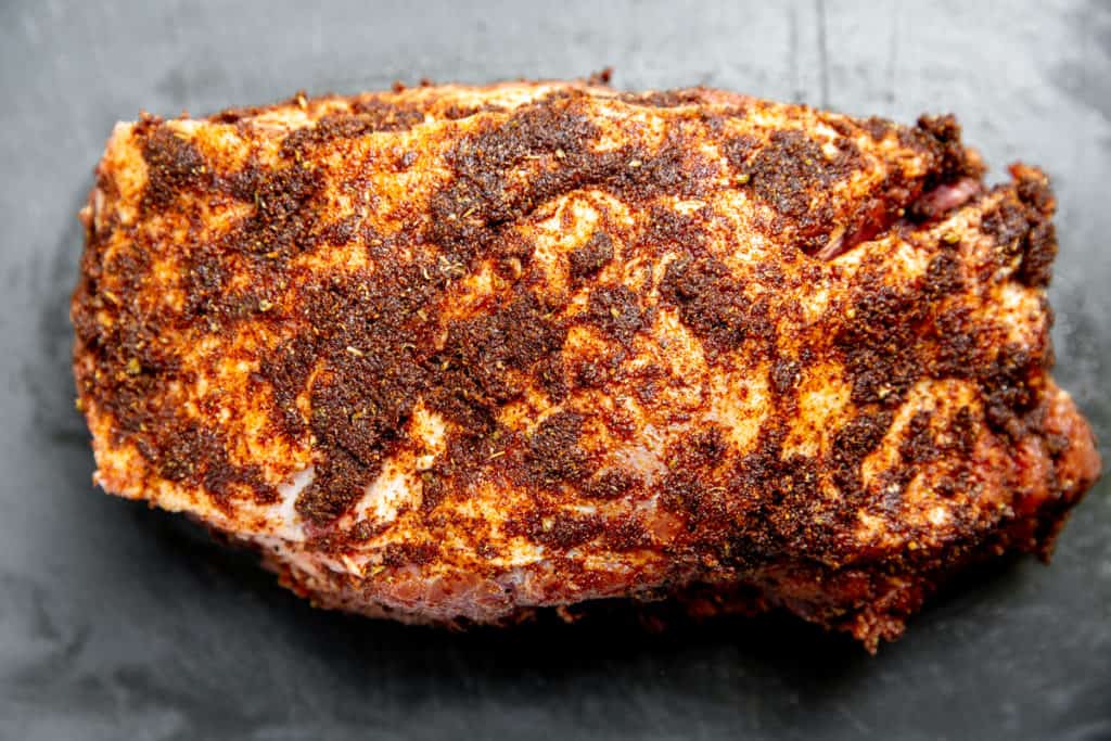 A pork shoulder rubbed with spice paste. 