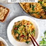 Peanut pork noodles in a bowl with chopsticks.