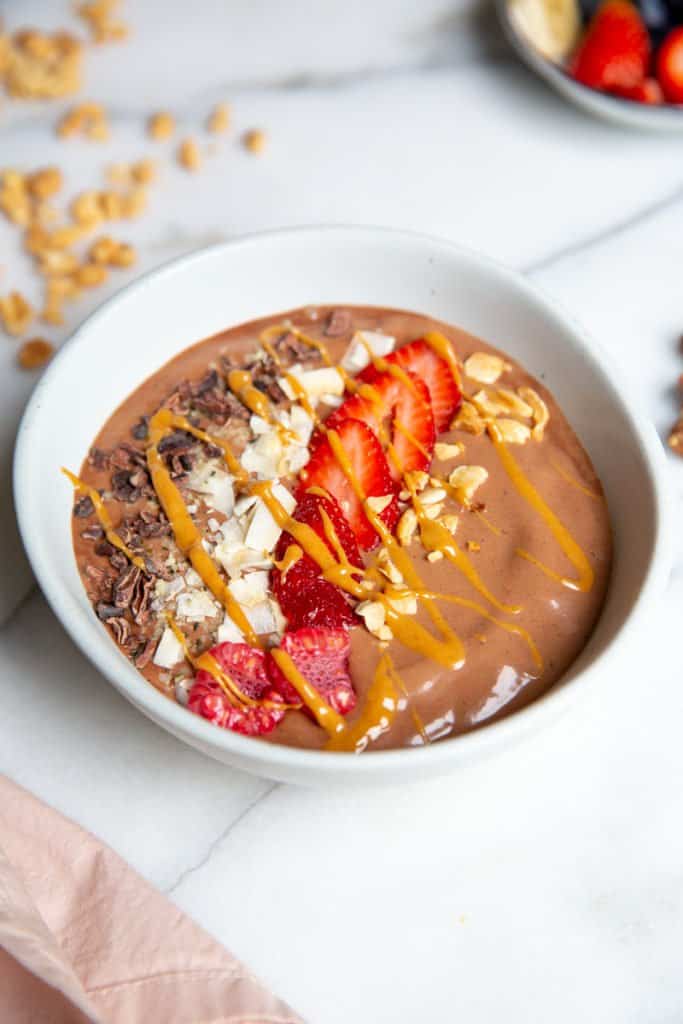 Close up of a chocolate peanut butter smoothie bowl. 