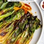 Hoisin glazed baby bok choy on a serving platter.