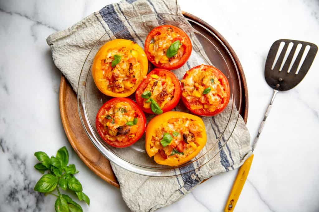 Baked stuffed tomatoes in a bowl.