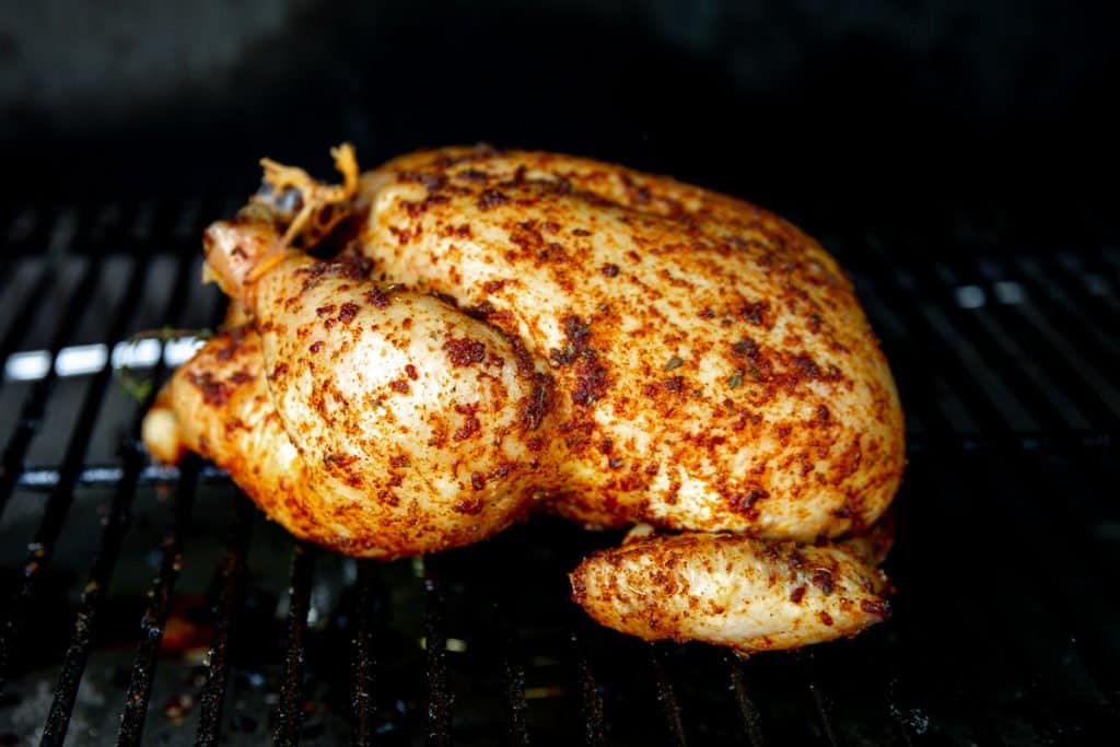 Whole chicken on a smoker.