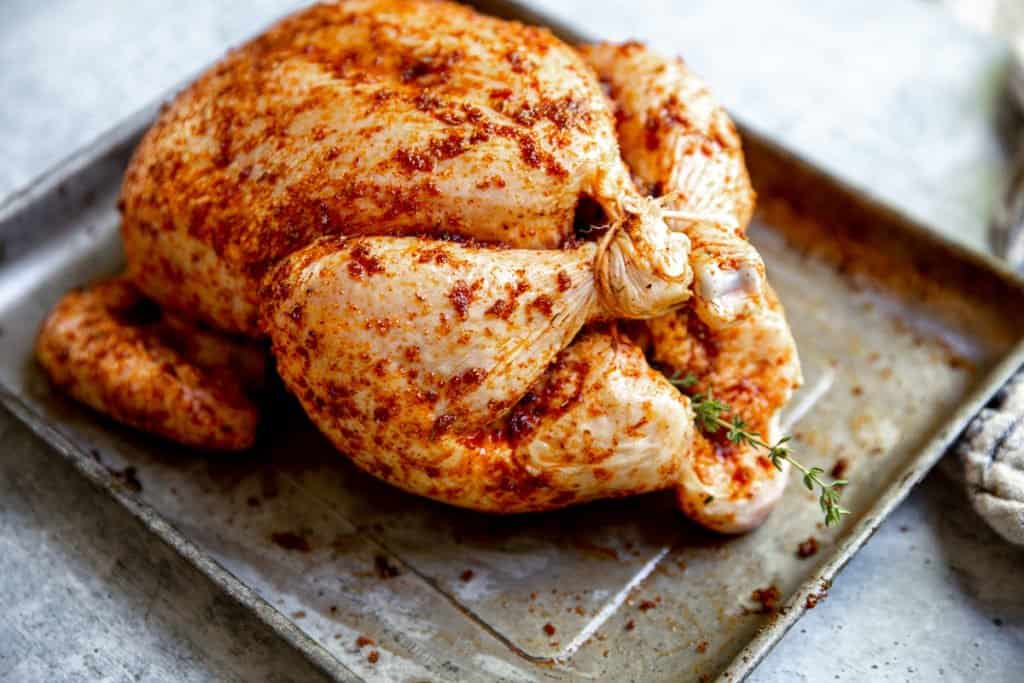 Whole chicken stuffed with spices and herbs.