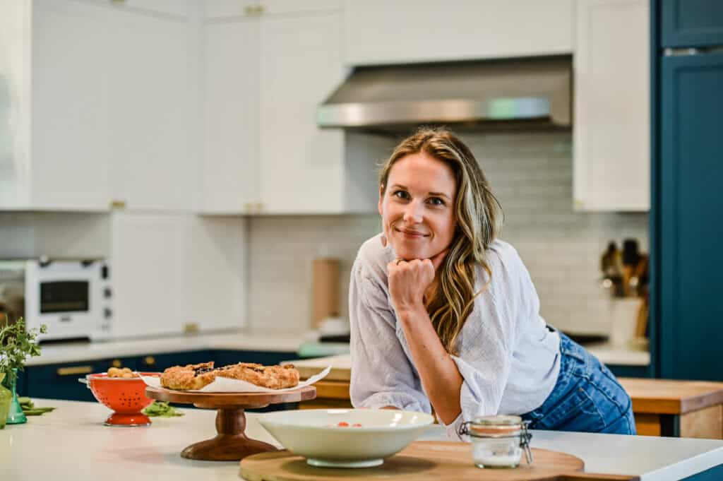 Nicki Sizemore at her kitchen counter with food. 