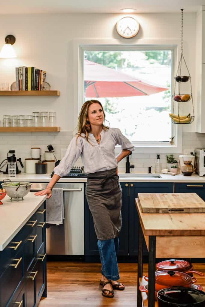Nicki Sizemore standing in her kitchen.