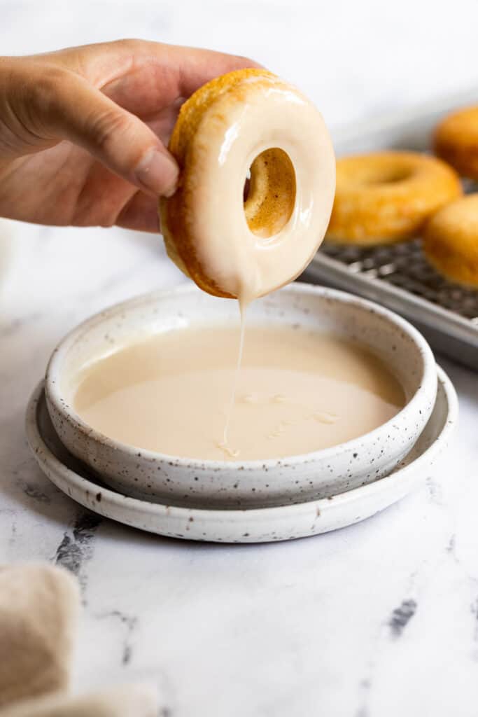 Donut dip in a bowl with maple glaze.