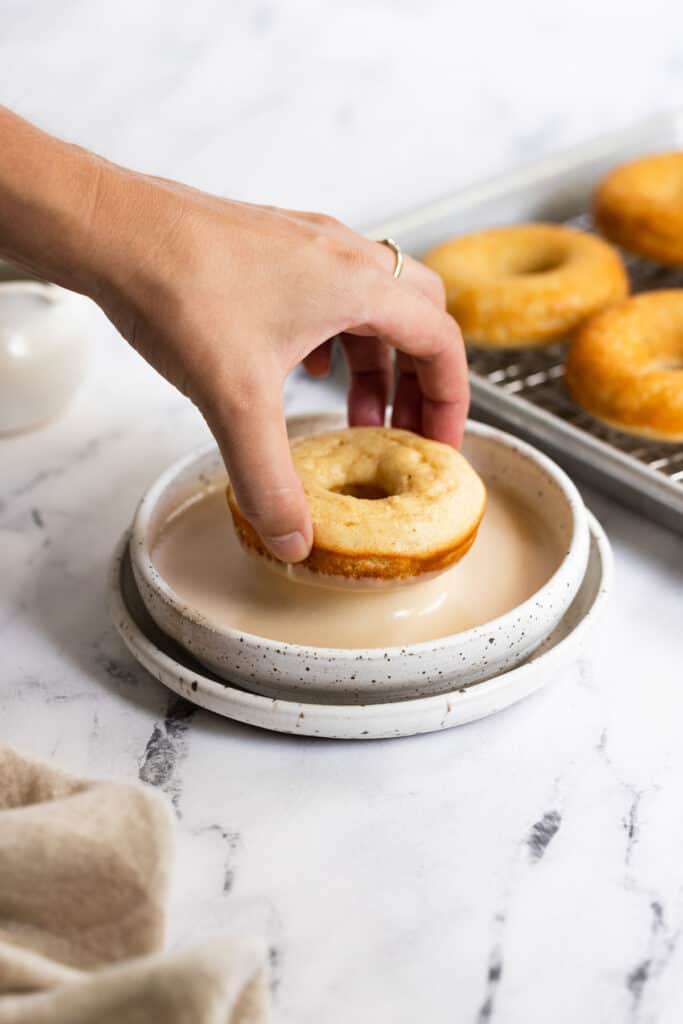Donut dip in the maple glaze bowl.
