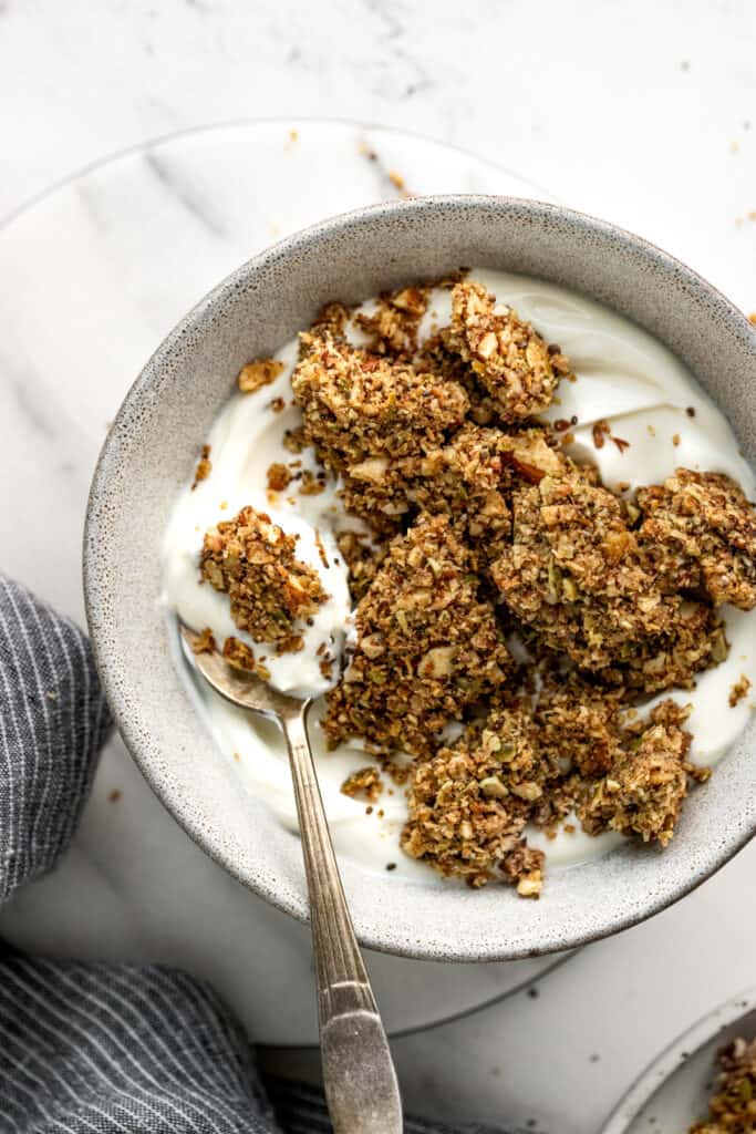 Grain free granola clusters with yogurt in a bowl.