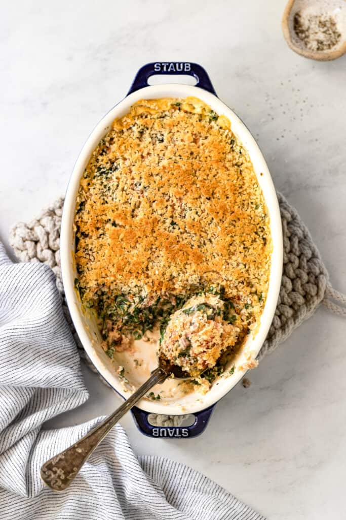 The gratin in a baking dish with a serving removed. 