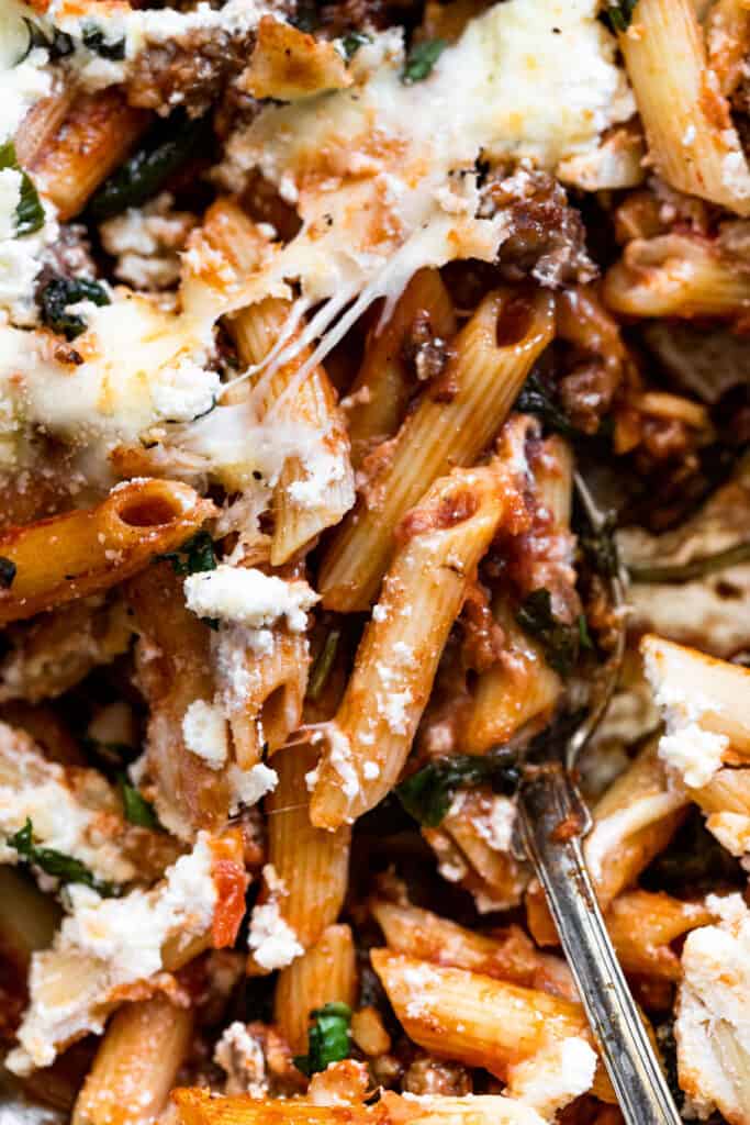 Close up of a baked penne with ricotta and sausage.