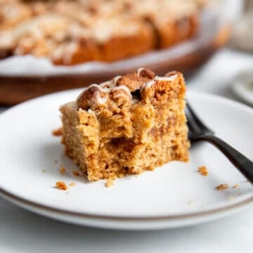A slice of gluten free coffee cake with a bite removed