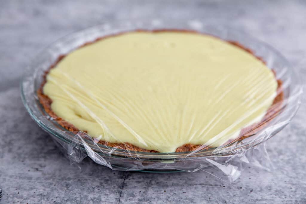 custard poured into the pie plate and wrapped with plastic wrap