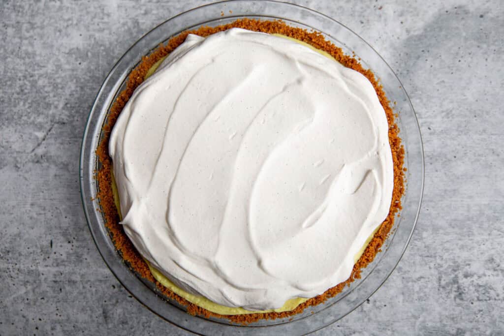 whipped cream spread over the top of the pie