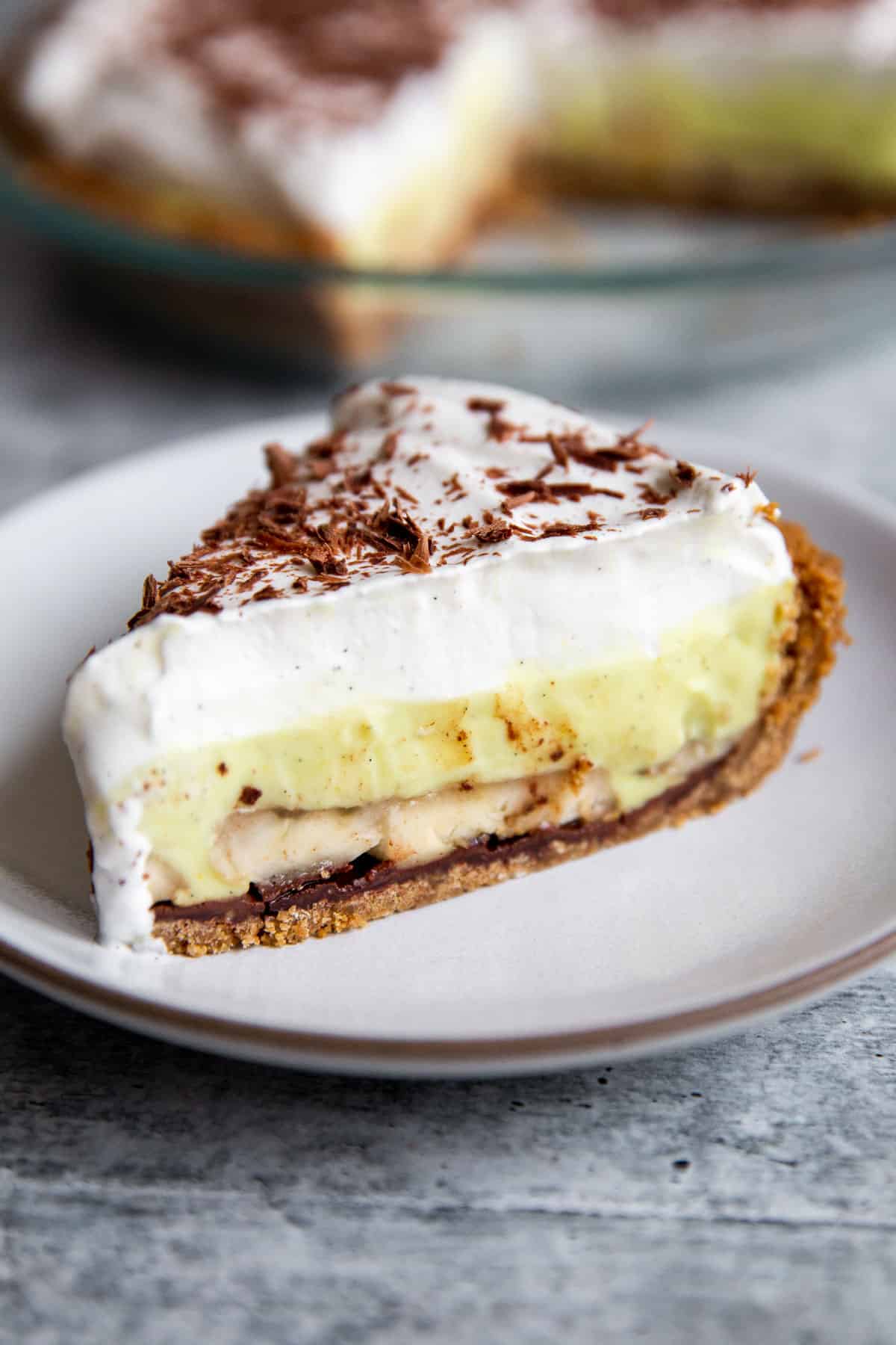 a slice of vegan banana cream pie on a plate