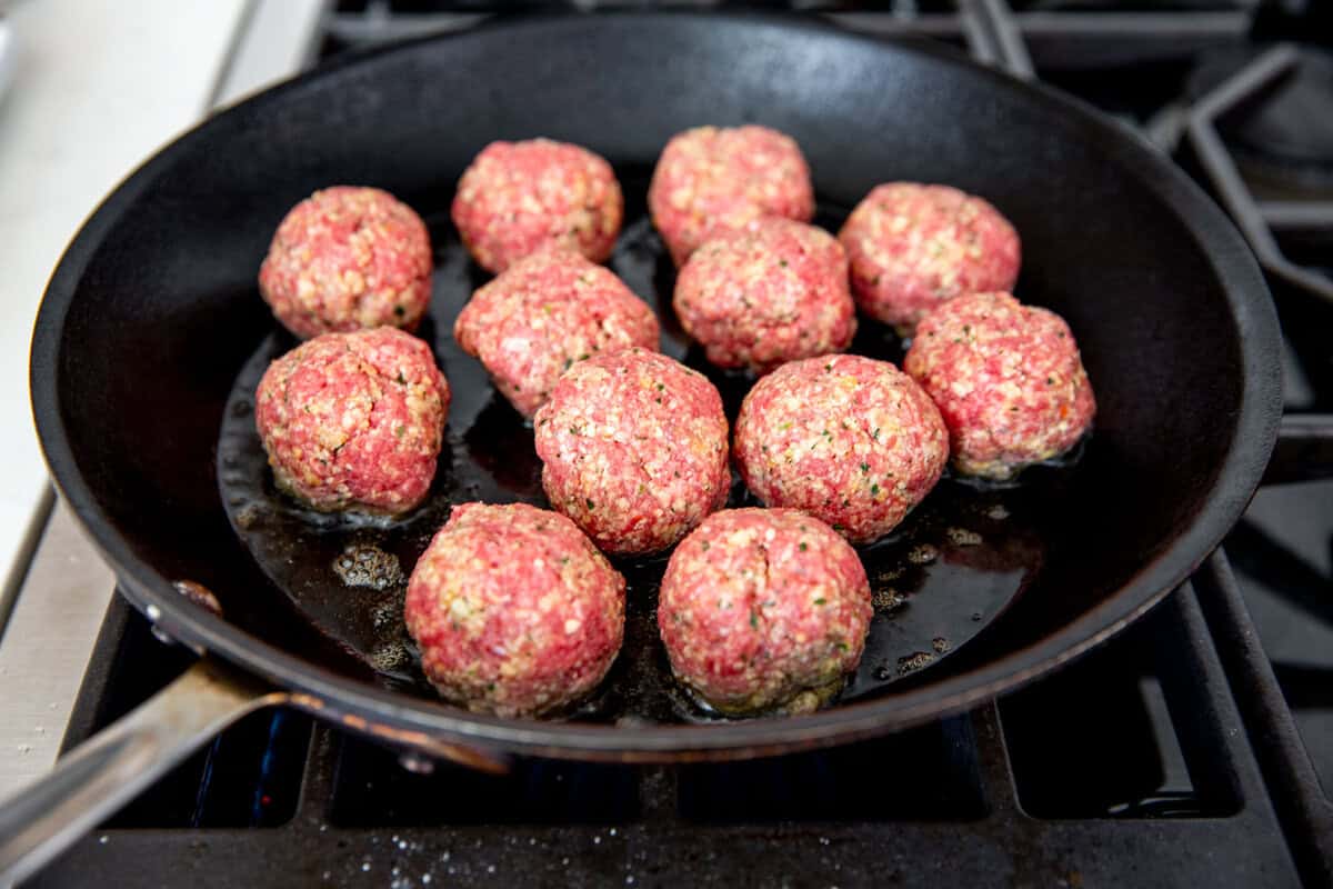 raw meatballs in a pan