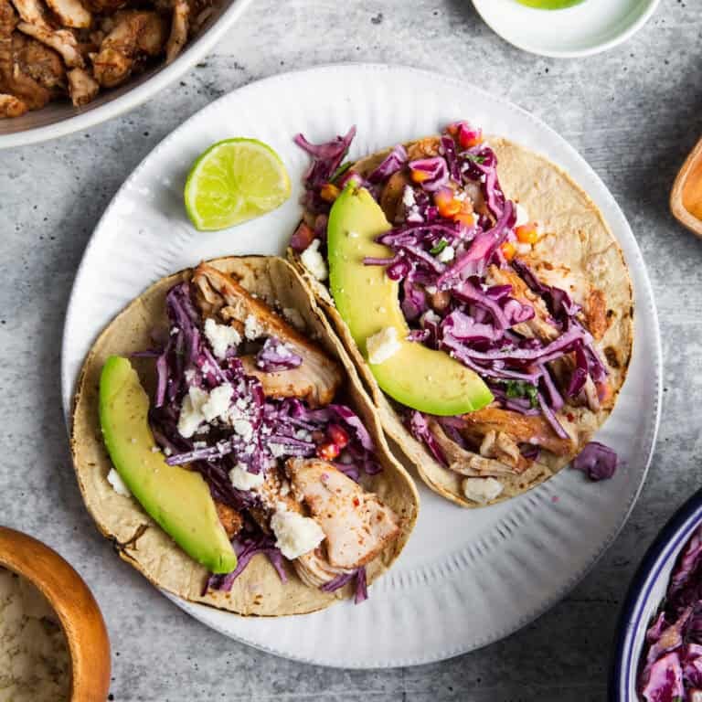 two tortillas filled with slow cooker shredded chipotle chicken
