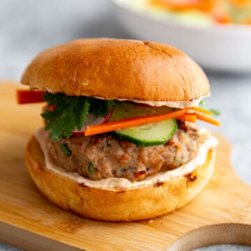 a banh mi burger on a cutting board