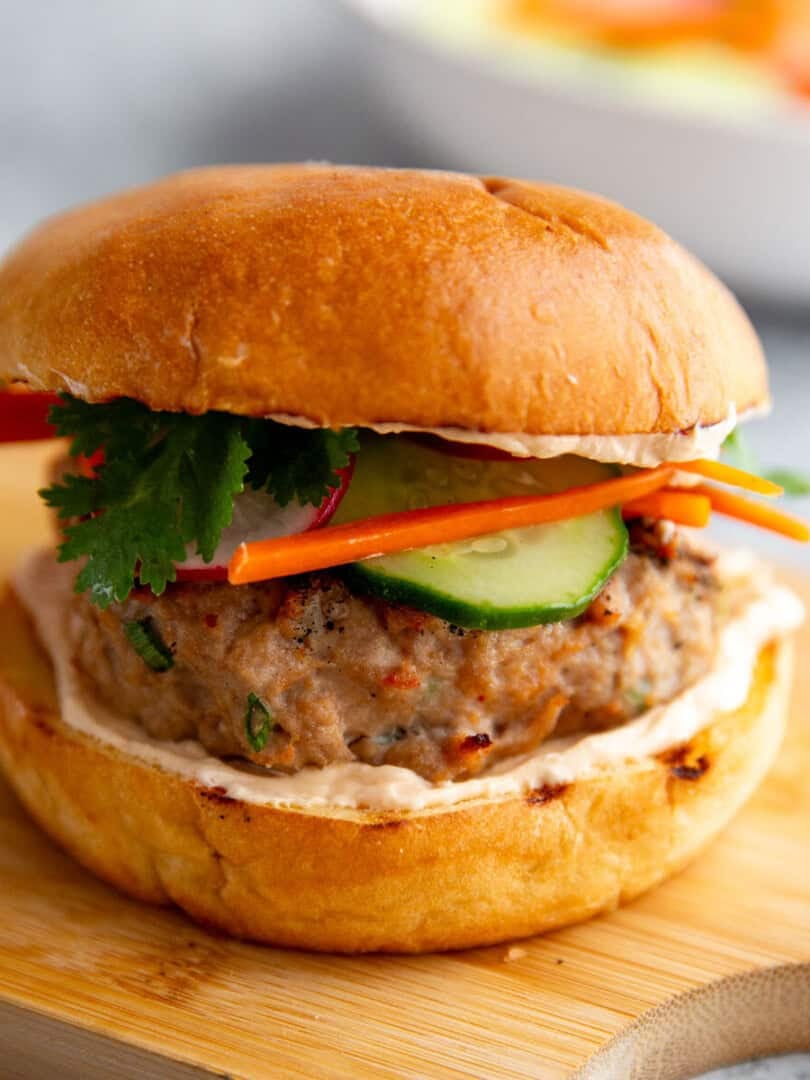 a banh mi burger on a cutting board
