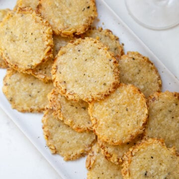 cheese wafers on a white platter