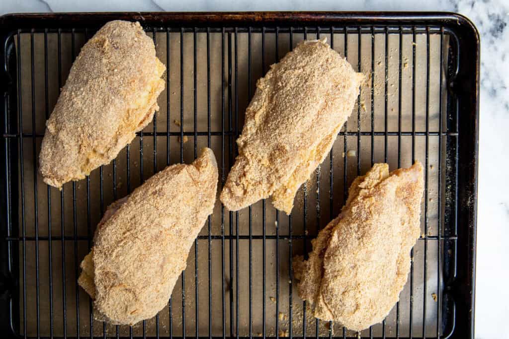 baking the chicken on a wire rack on top of a baking sheet 