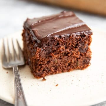 gluten-free zucchini cake on a plate with a fork