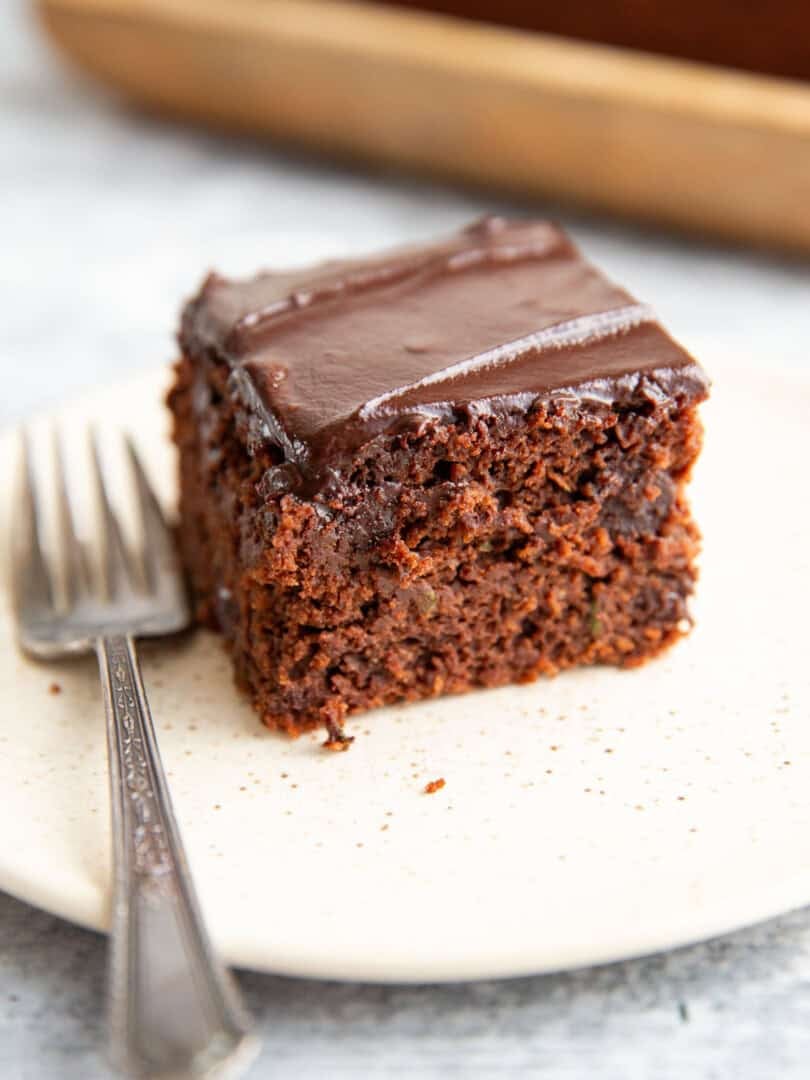 gluten-free zucchini cake on a plate with a fork