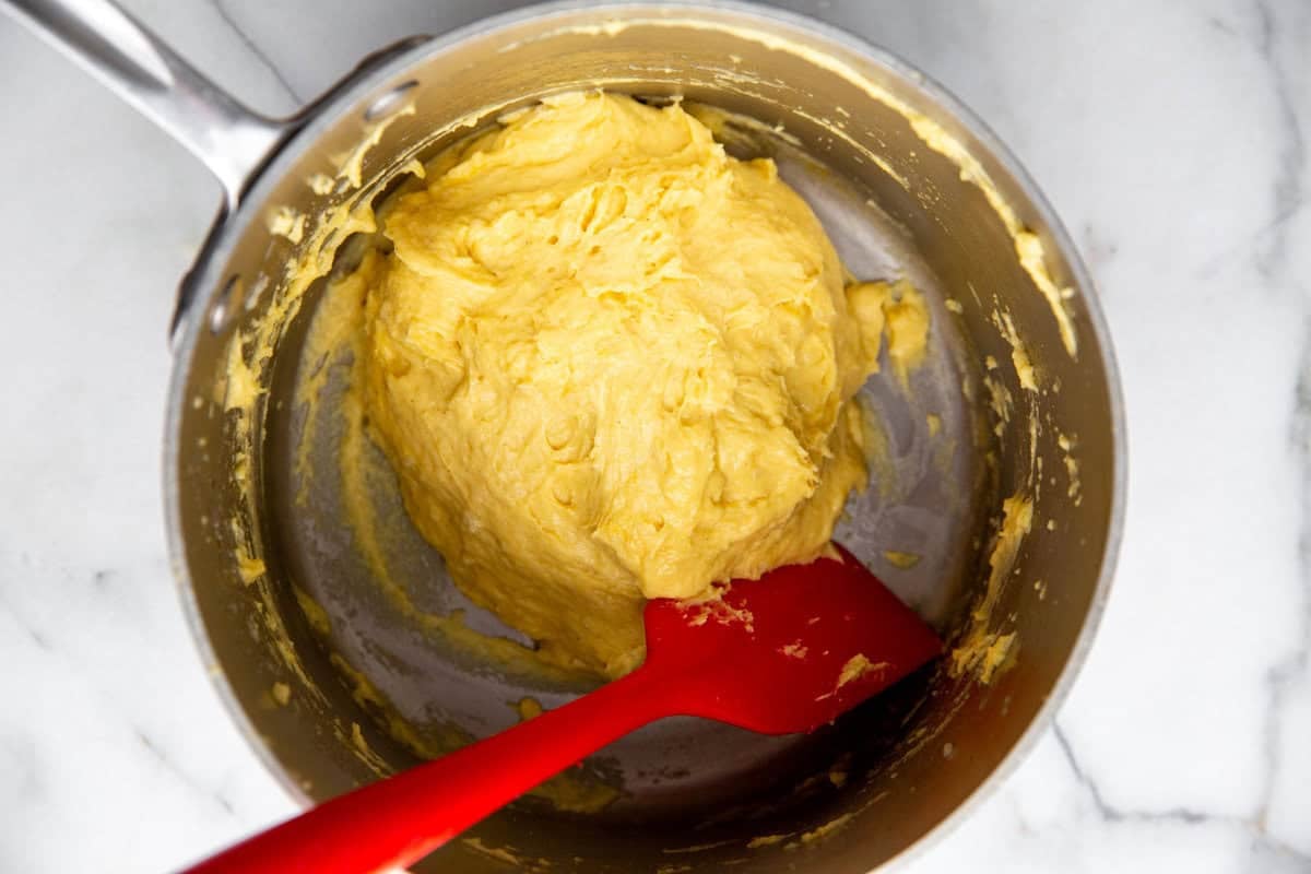 choux pastry dough in a large bowl 