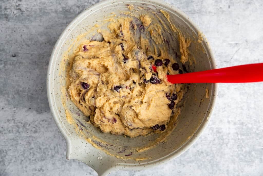 blueberry banana batter in a large mixing bowl.