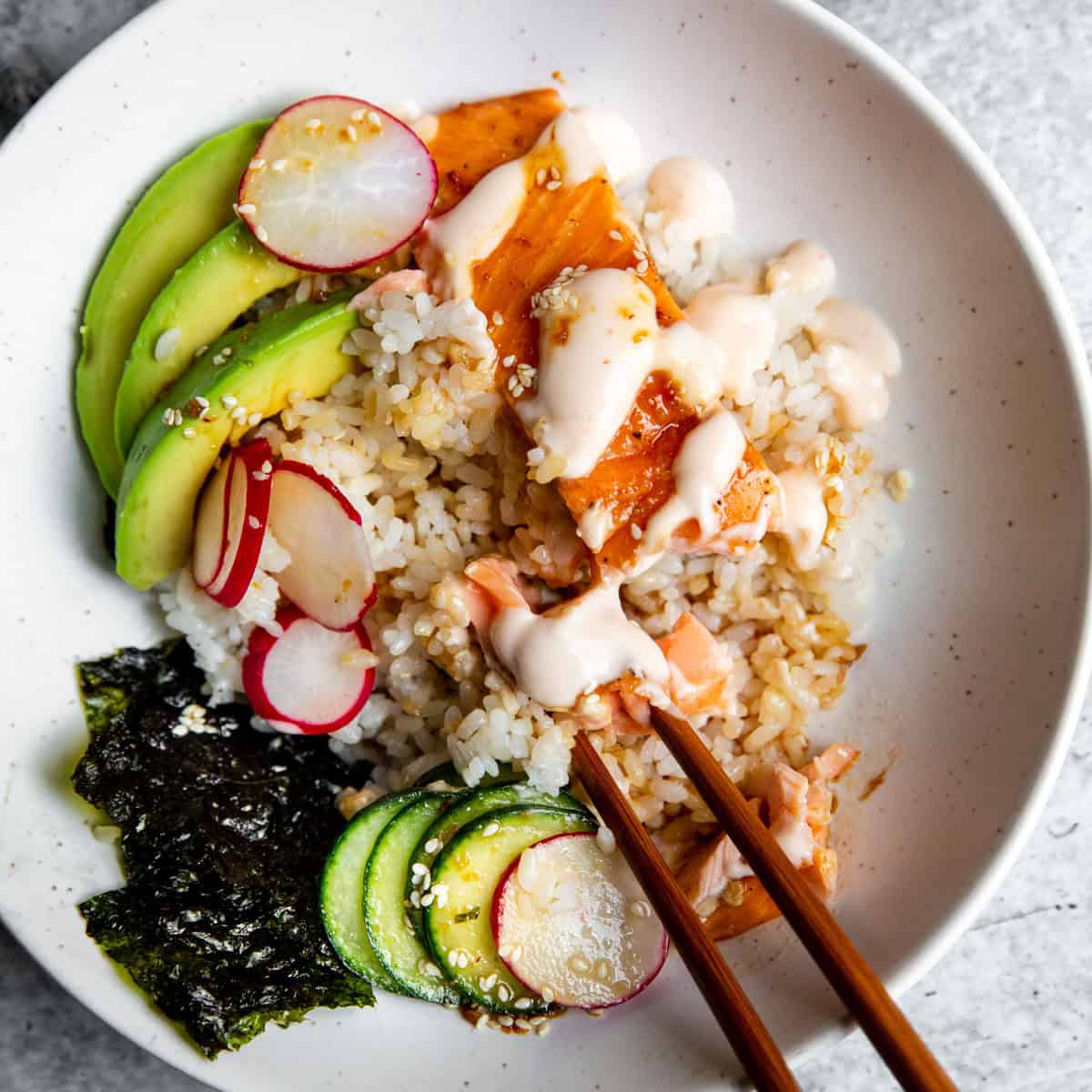 Chopsticks sitting in a bowl meal.