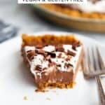 Slice of chocolate pudding pie with bite removed.