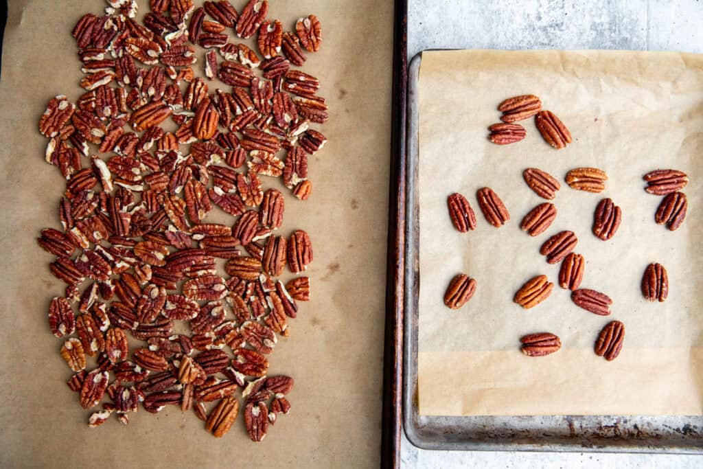 pecans toasting on a baking sheet
