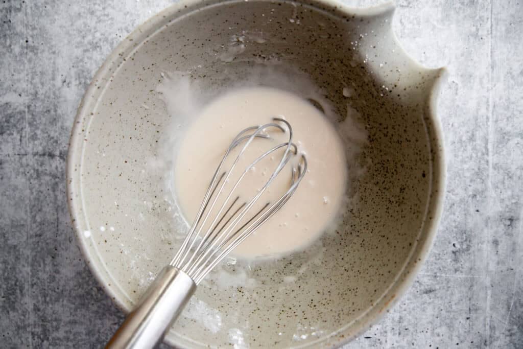 icing ingredients mixed into a large bowl