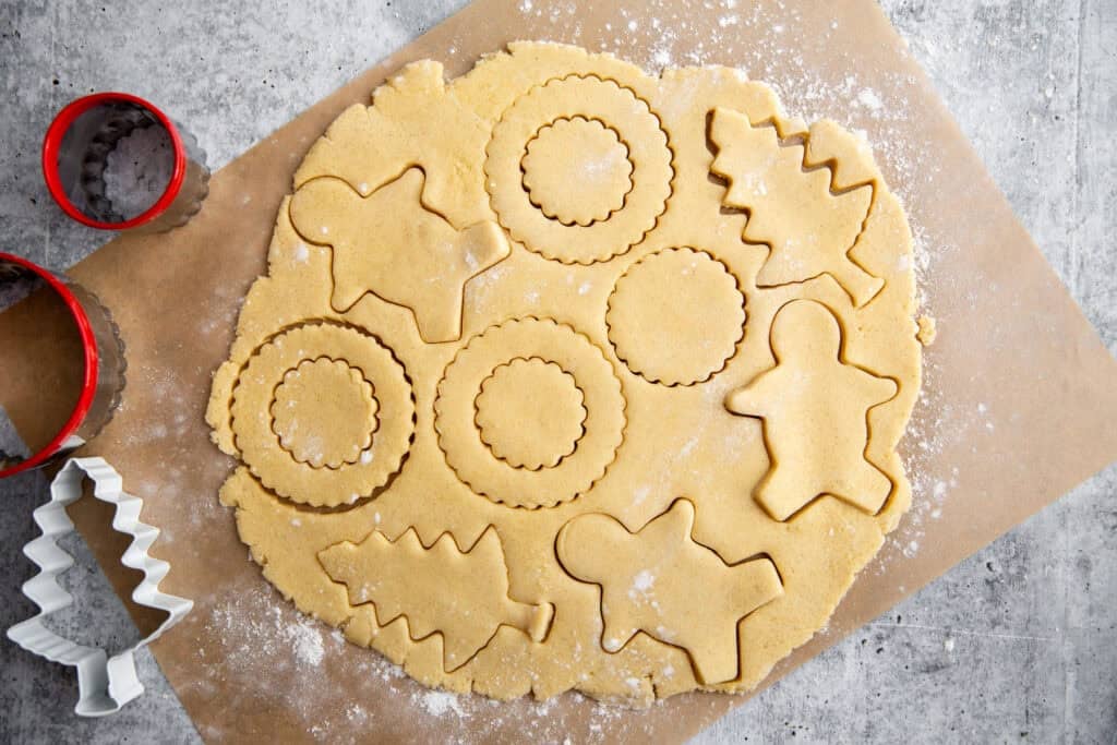 cookie cutter shapes pressed into the rolled dough