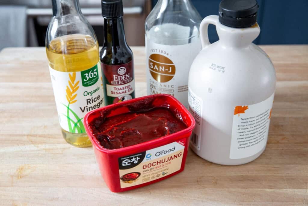 gochujang salmon ingredients on a wooden cutting board