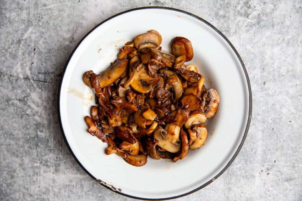 sauteeing the veggies for the salmon bowls