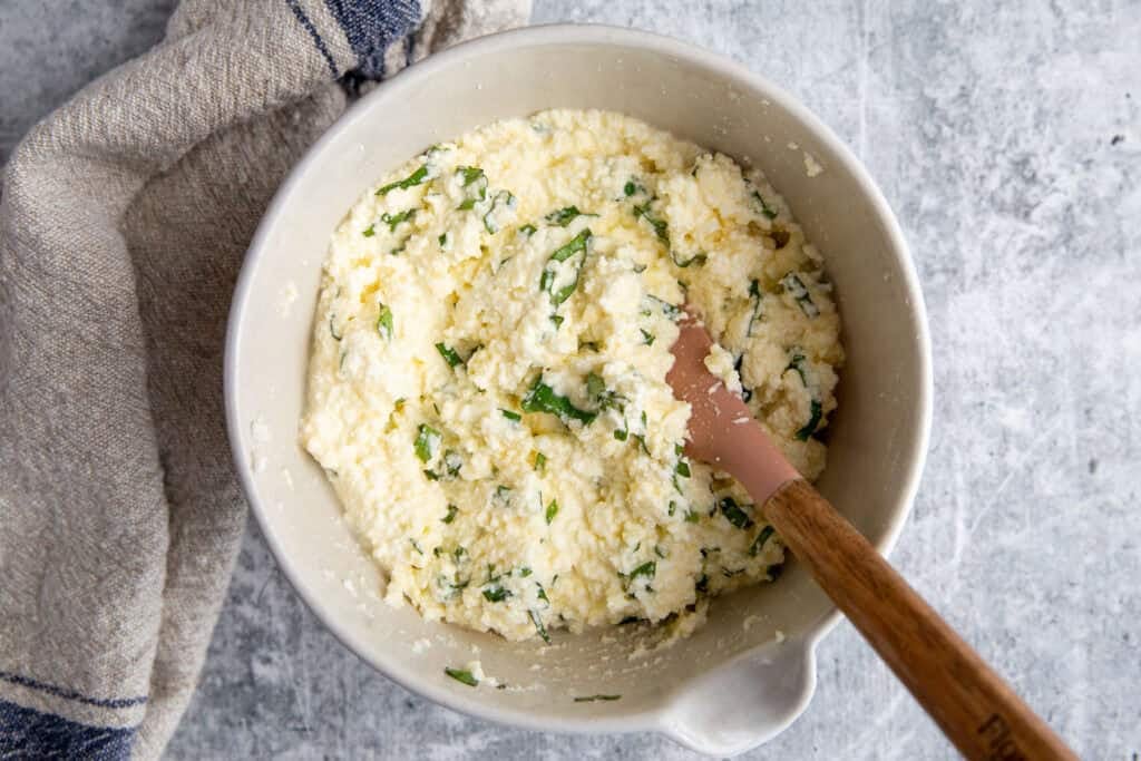 Ricotta mixture in a bowl for the the lasagna filling.