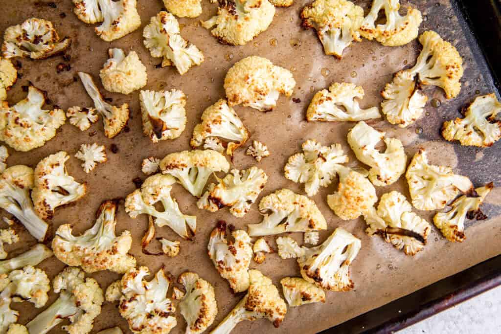 cauliflower roasting on a sheet pan