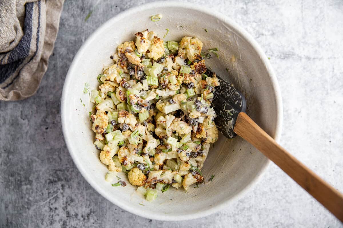 roasted cauliflower salad in a white bowl