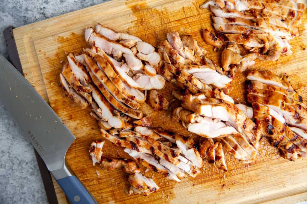 Sliced grilled miso chicken on a cutting board after grilling.